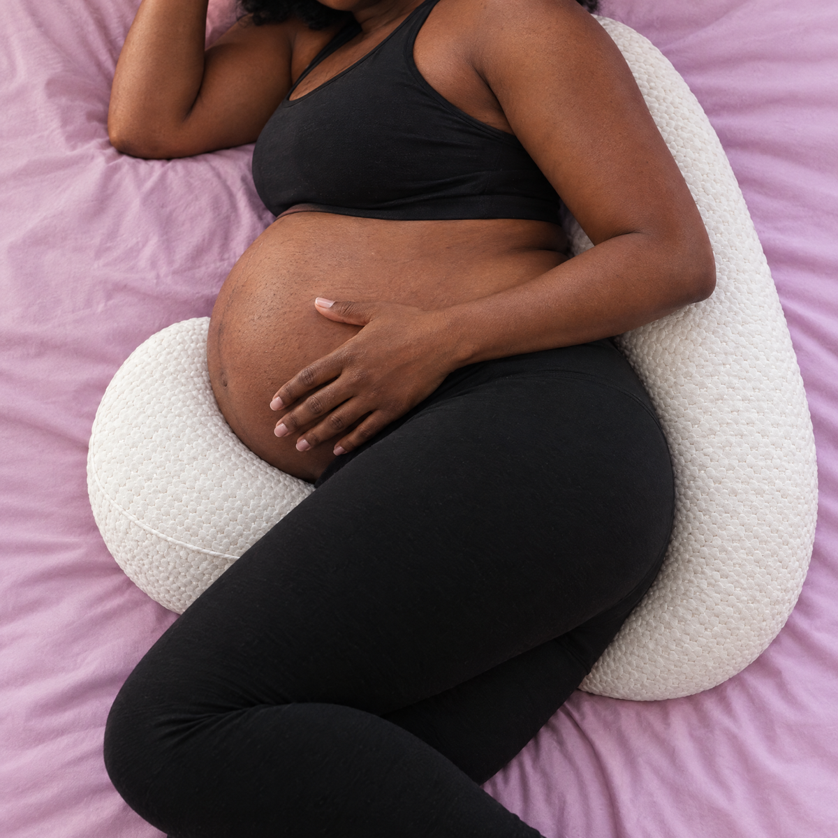 Bump Nest Plus long pillow behind the back and wedge under the bump